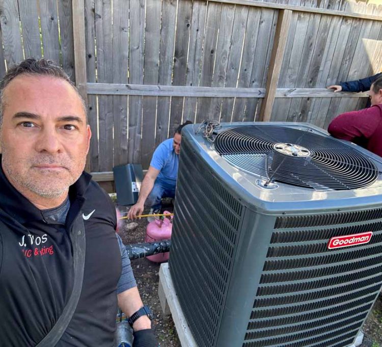 J. Tullos Services replacing an air conditioning system with a new Goodman unit